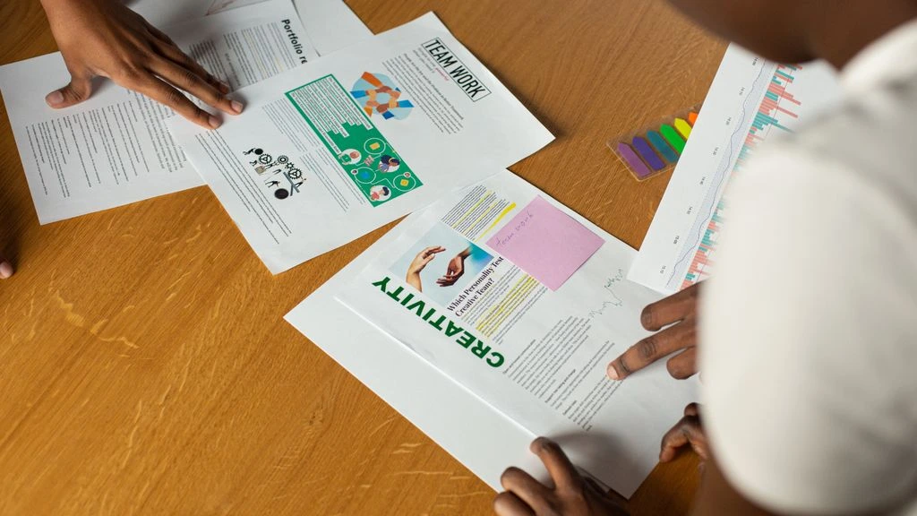 Creative team reviewing ad variants in a studio